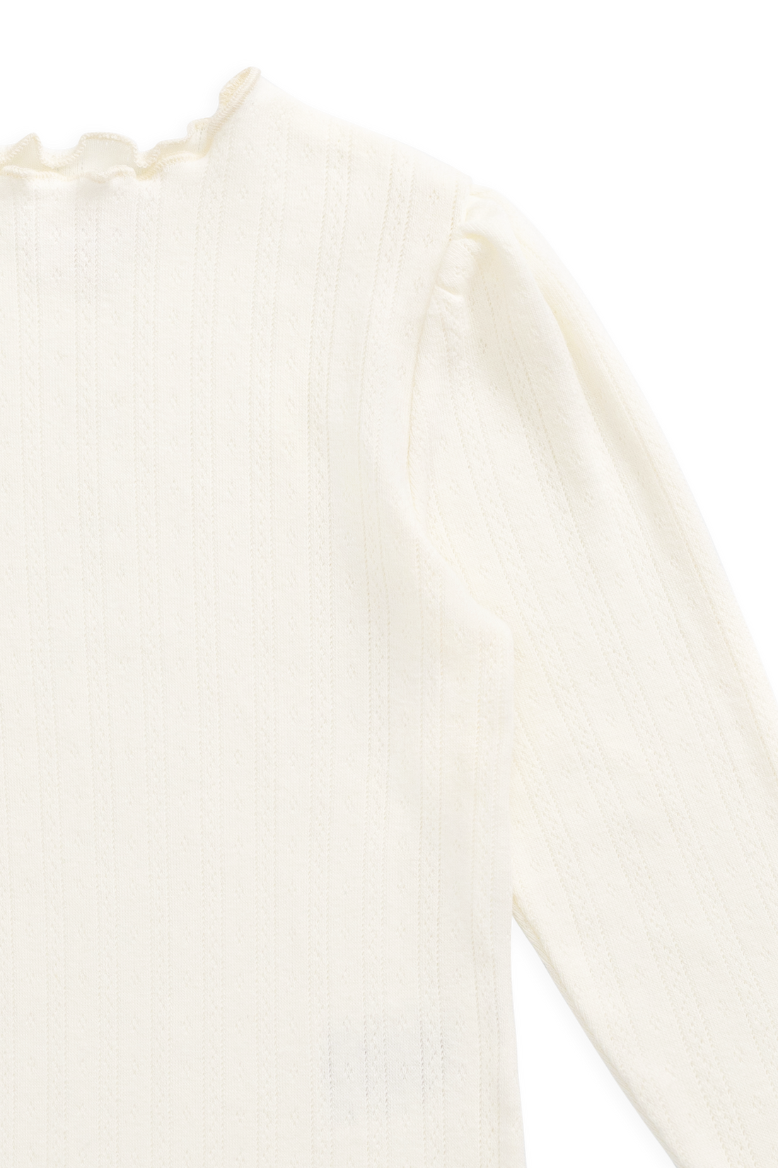 Close-up of a white lace garment on a white background