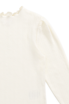 Close-up of a white lace garment on a white background