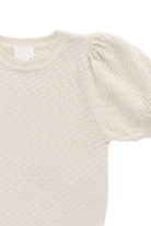 Beige sweater with puff sleeves on a white background