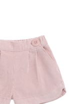 Pink shorts with a button on a white background