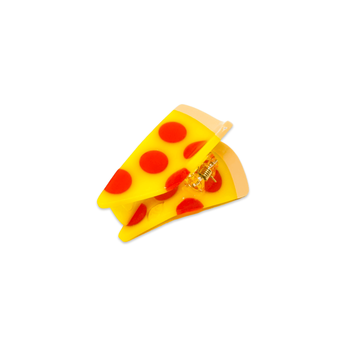Toy resembling a slice of pizza with red dots on a white background