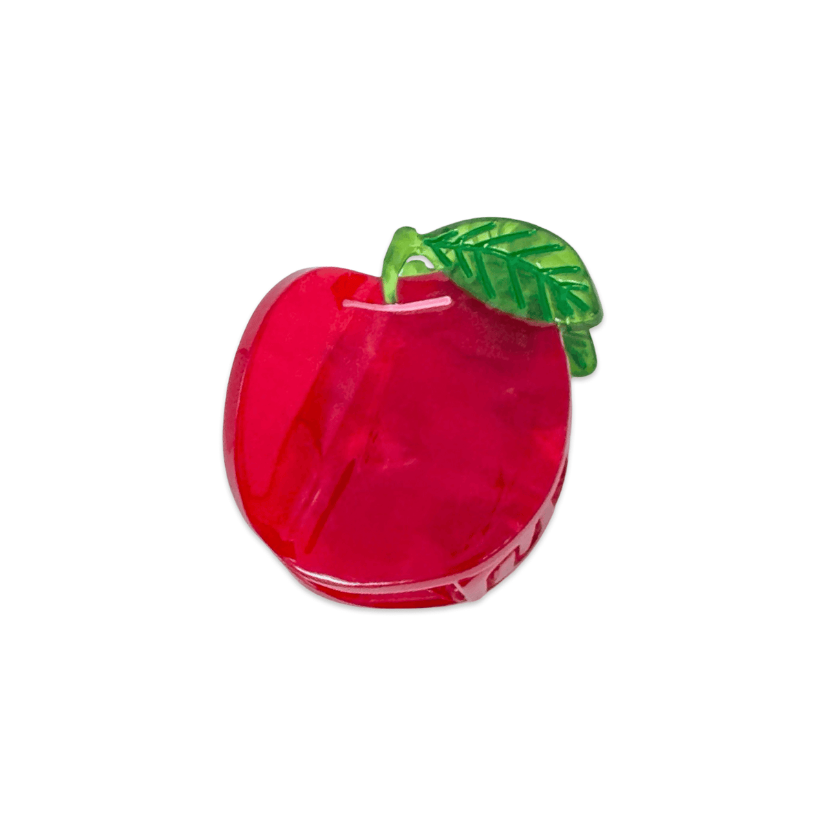Red apple-shaped object with a green leaf on a white background