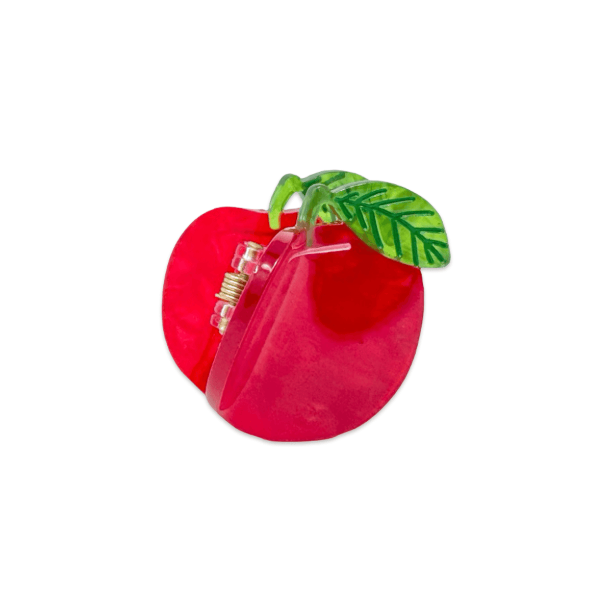Red apple-shaped clip with a green leaf on a white background