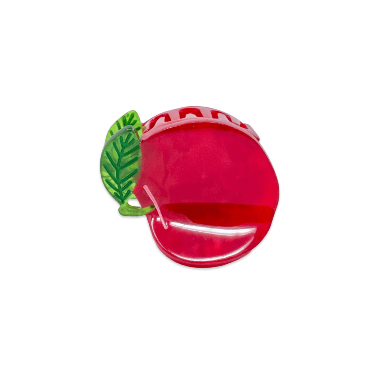 Red apple-shaped container with a green leaf on a white background