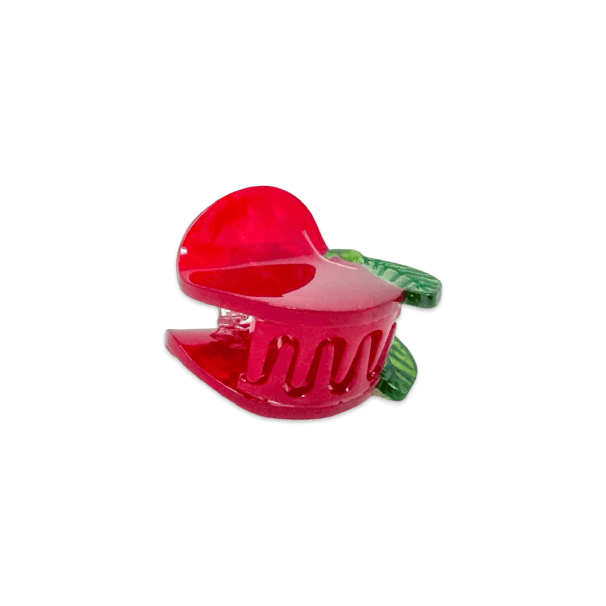 Red apple-shaped hair clip on a white background