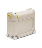 Beige suitcase with yellow accents on a white background