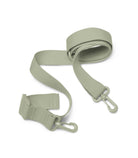 Green strap with buckles on a white background
