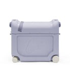 Light purple suitcase with wheels on a white background