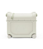 Light gray suitcase with wheels on a white background