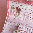 Set of hair accessories with decorative packaging featuring star patterns and a brand name.