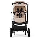 Beige baby stroller with black frame on a white background