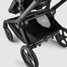Black stroller on a light gray background