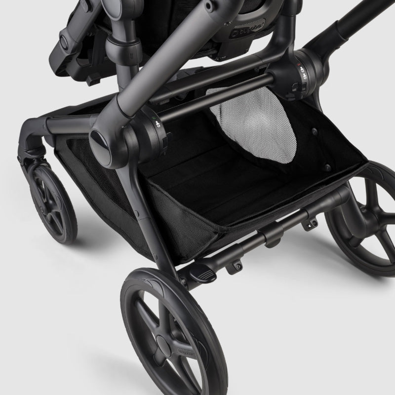 Black stroller on a light gray background