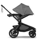 Black and gray stroller on a white background