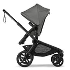Black and gray stroller on a white background