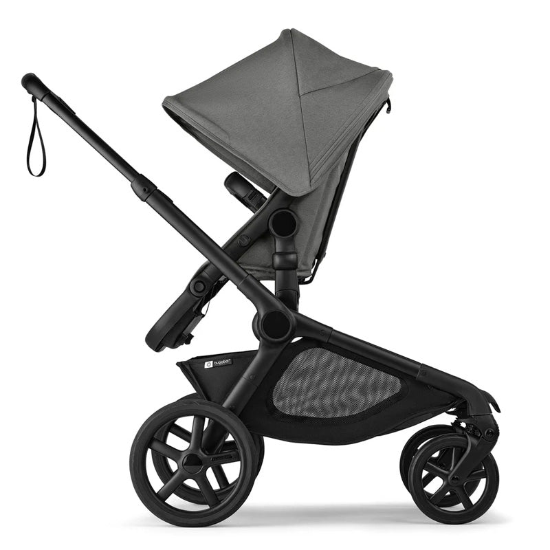 Black and gray stroller on a white background