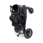 Black stroller with brown accents on a white background