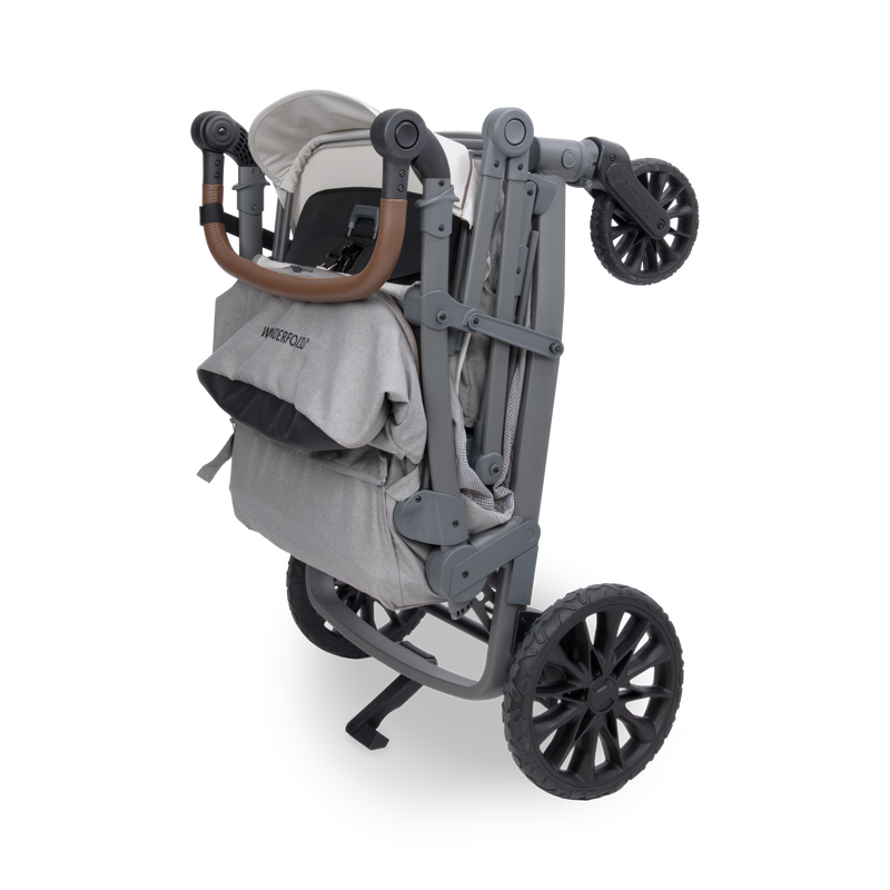 Gray and black stroller with a baby seat on a white background