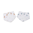 Two baby bibs with teddy bear and sailboat patterns on a white background