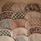 Collection of patterned fabric patches arranged in a decorative manner.