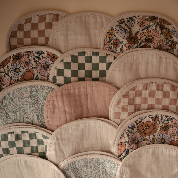 Collection of patterned fabric patches arranged in a decorative manner.