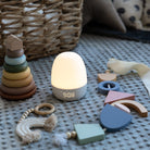 Children's night light with toys on a textured surface