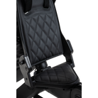 Black quilted car seat cover on a white background