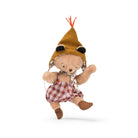 Stuffed teddy bear wearing a knitted hat and checkered overalls on a white background