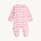 Pink baby onesie with a pattern on a white background