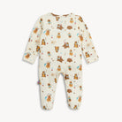 A baby long-sleeve footed sleeper in cream with an all-over print of cartoon bears, squirrels, and rabbits in brown, orange, and blue, displayed flat against a light gray background.