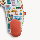 Colorful children's socks with cityscape pattern and red sole on a white background