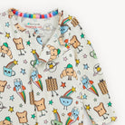Children's shirt with colorful character design on a white background