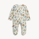 A baby footed sleeper in an off-white color with a colorful cartoon pattern of animals, rainbows, stars, and clouds, shown flat on a light gray background.