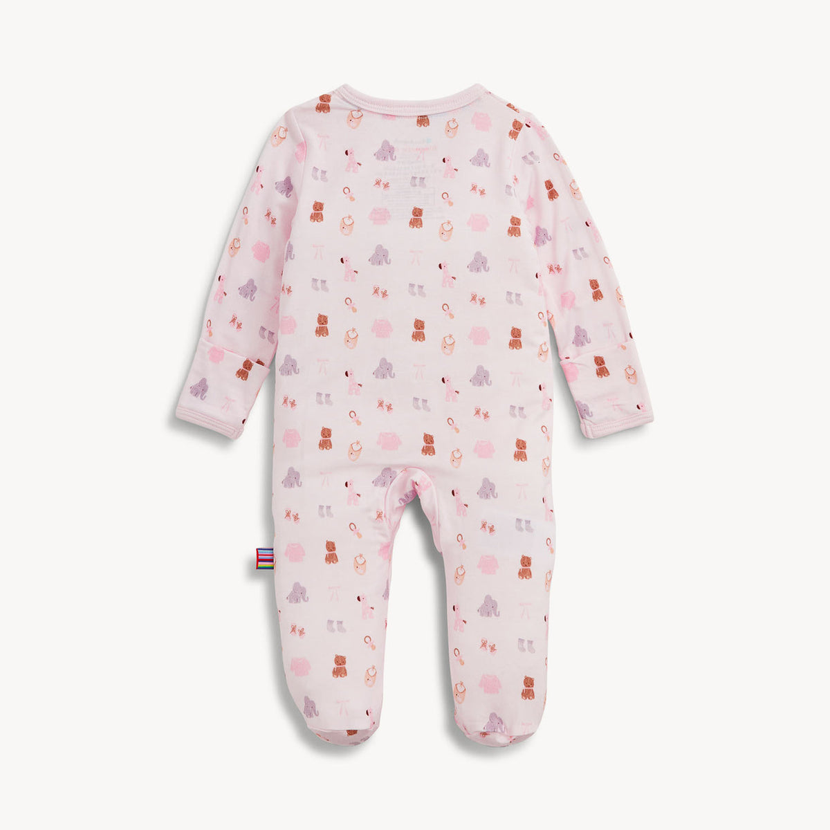 A baby footed sleeper in light pink with an all-over print of teddy bears, snow globes, and snowman faces in darker pink, purple, and brown, shown flat on a light off-white background.
