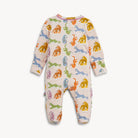 A baby footed sleeper with long sleeves and an all-over colorful dinosaur print on a light pink background, shown against a plain light gray background.