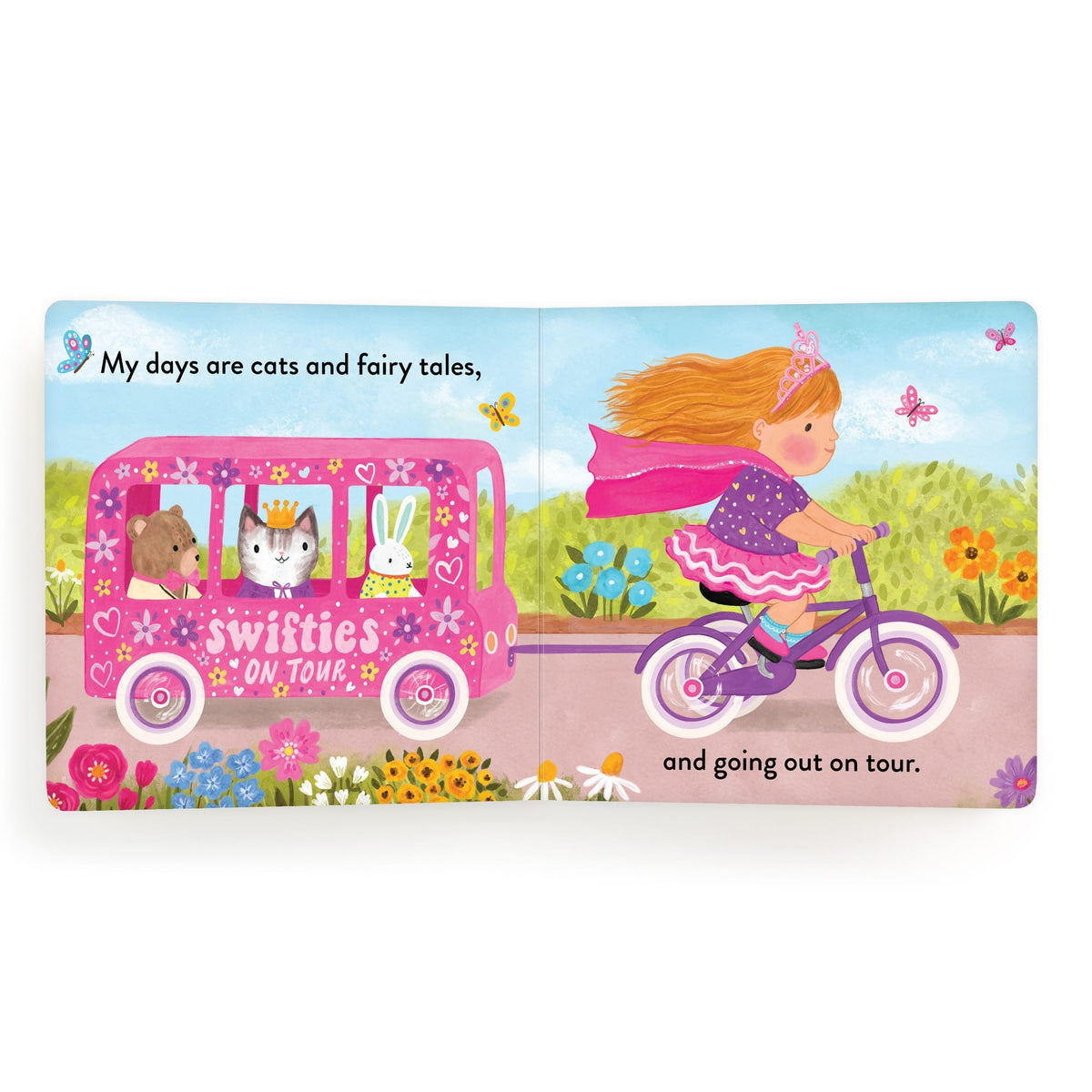 Children's book page with a girl on a bike and a pink vehicle with animal characters, set against a colorful outdoor background.