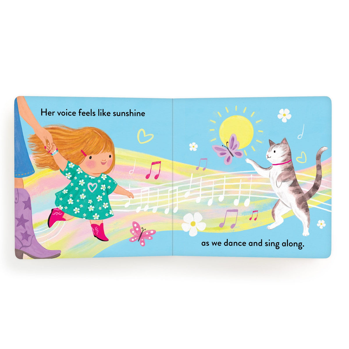 Children's book page with a girl, cat, and musical notes on a blue background