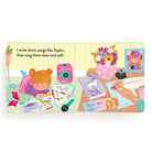 Children's book with illustrations of a girl writing and a table with stationery items on a white background.