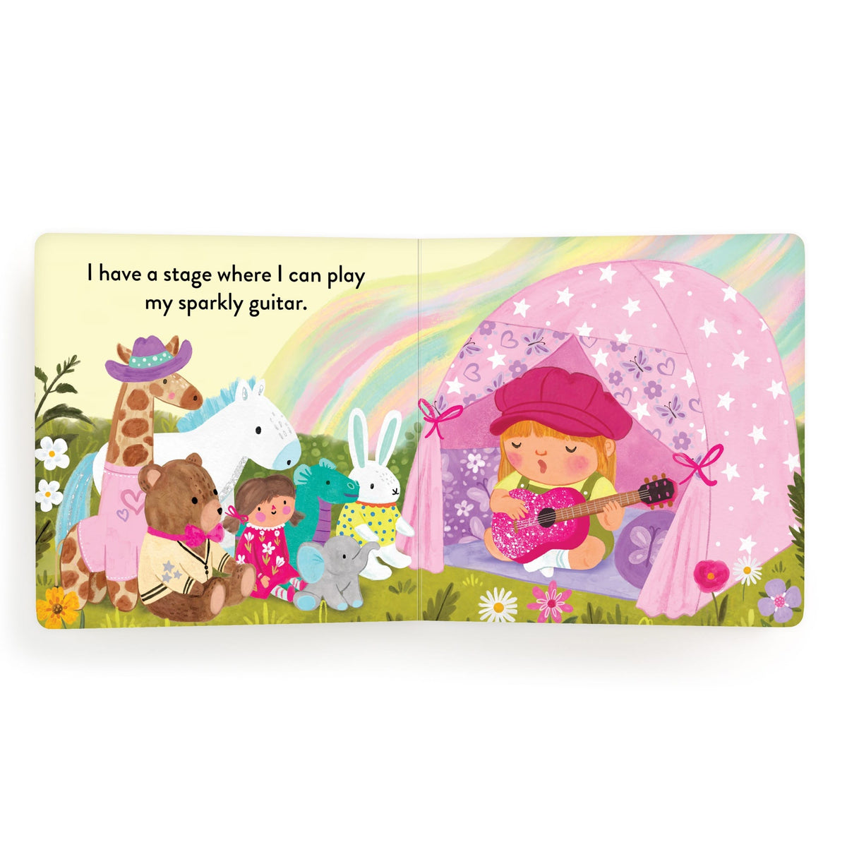 Children's book page with a girl playing guitar, surrounded by animals and a rainbow.