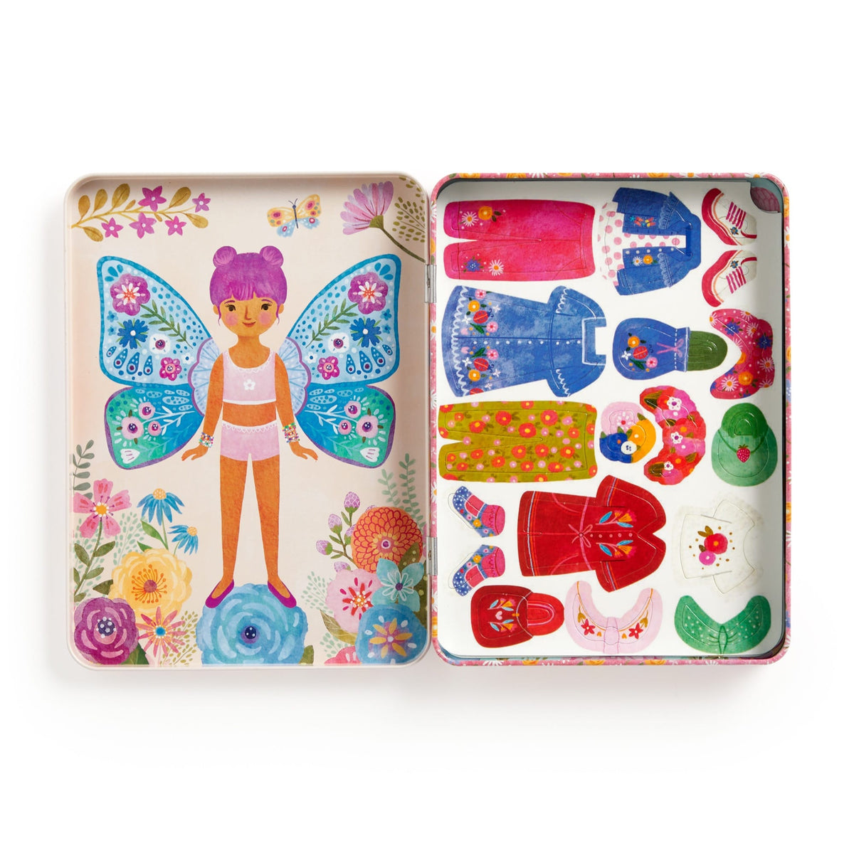 Colorful toy tin with a fairy design and various accessories on a white background