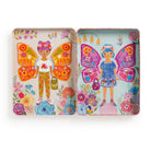 Two colorful tins with illustrations of girls with butterfly wings and floral designs on a white background.