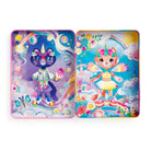 The Cat-icorn Magnetic Dress-up play set by Mudpuppy shows the open pink hinged tin displaying two different magical background scenes, each featuring a feline character ready for dress-up play.