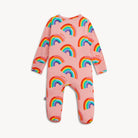 Pink baby onesie with rainbow pattern on a white background