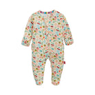 A baby footed sleeper with long sleeves and an all-over floral and bee print on a cream background, shown against a plain white background.