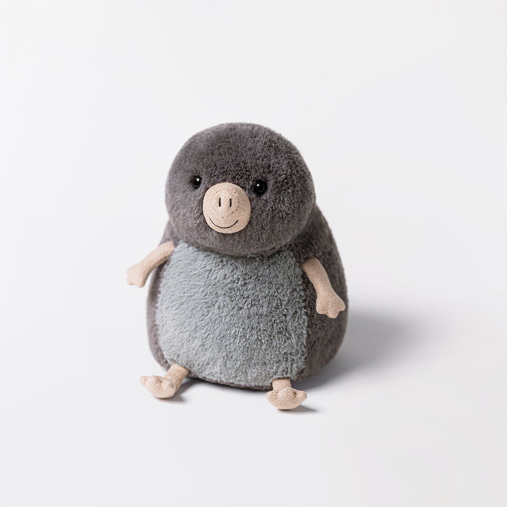 Plush toy penguin on a white background