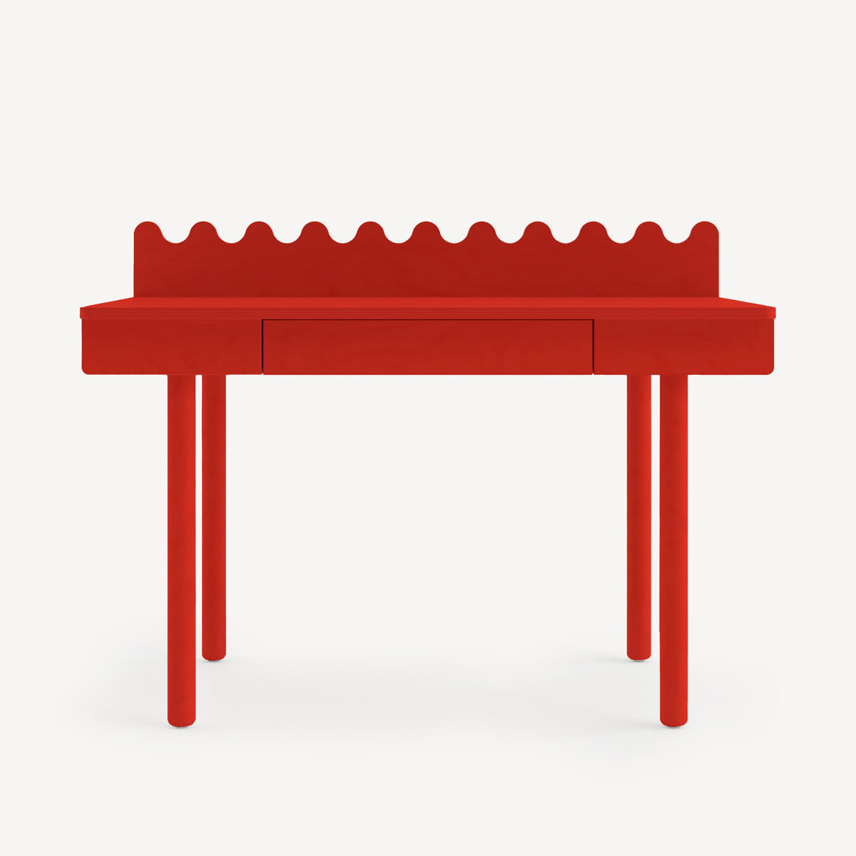 Red children's desk with scalloped edge on a white background
