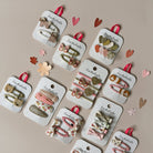 Collection of hair clips on display cards with decorative elements on a beige background