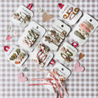 Assorted hair accessories on display with heart decorations on a checkered background
