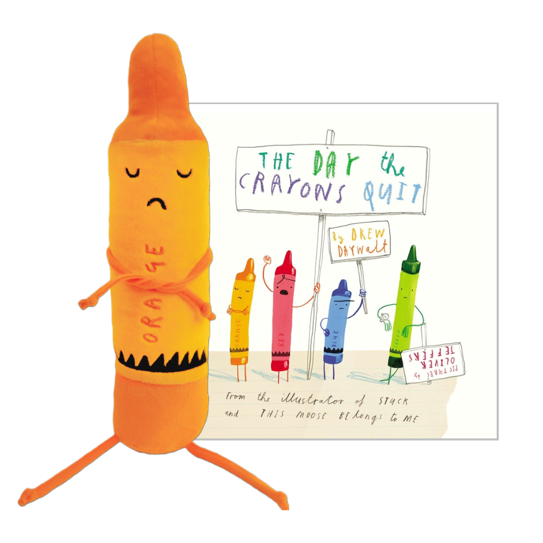 A plush toy crayon character standing next to a printed illustration card. The main plush is orange with a sad face and the word 'ORANGE' printed on it.