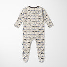 A baby footed sleeper with long sleeves and an all-over penguin print on a cream background, shown flat against a light gray background.